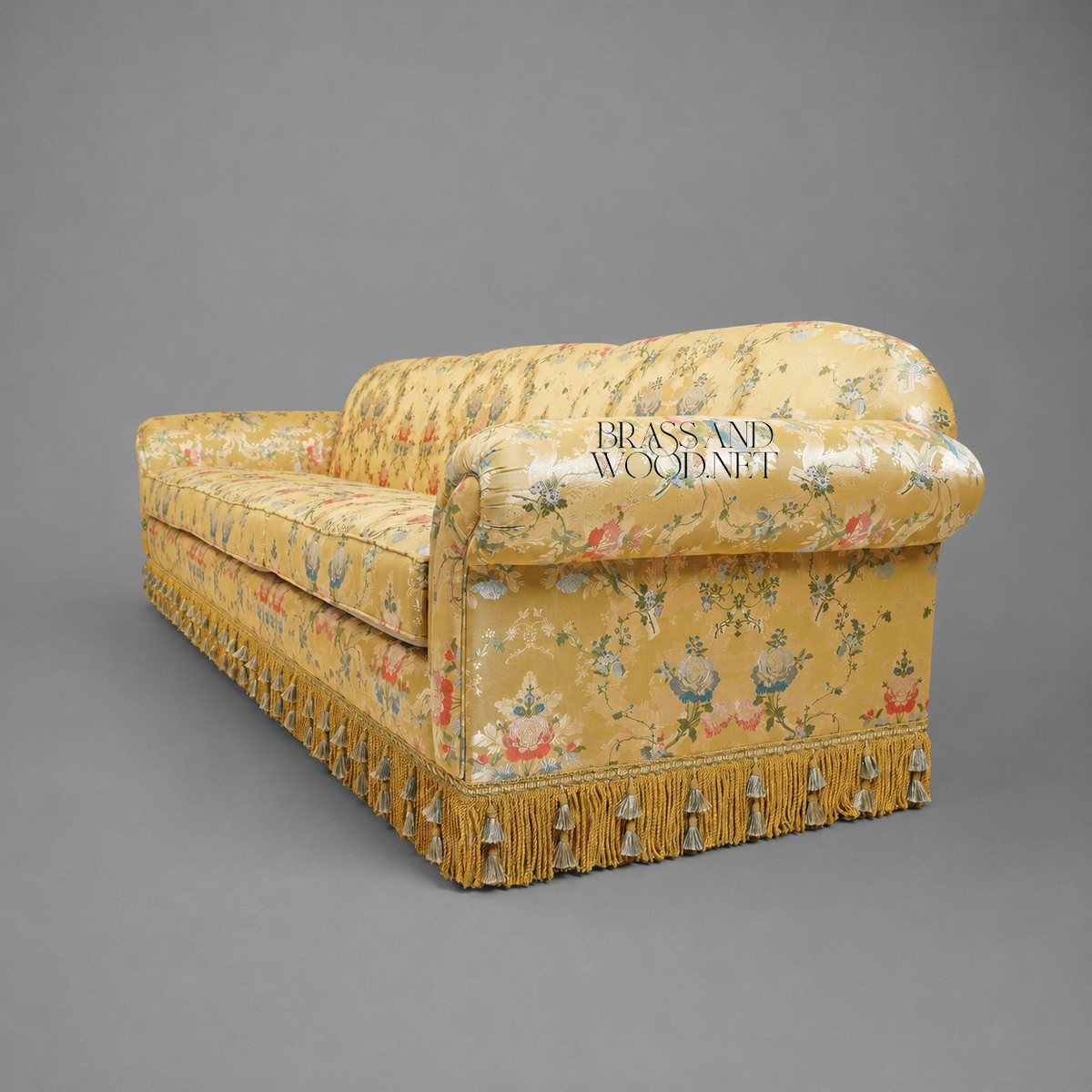 Belle Époque Floral Jacquard Grand Salon Sofa with Tassel Fringe Skirt Side View | Brass & Wood