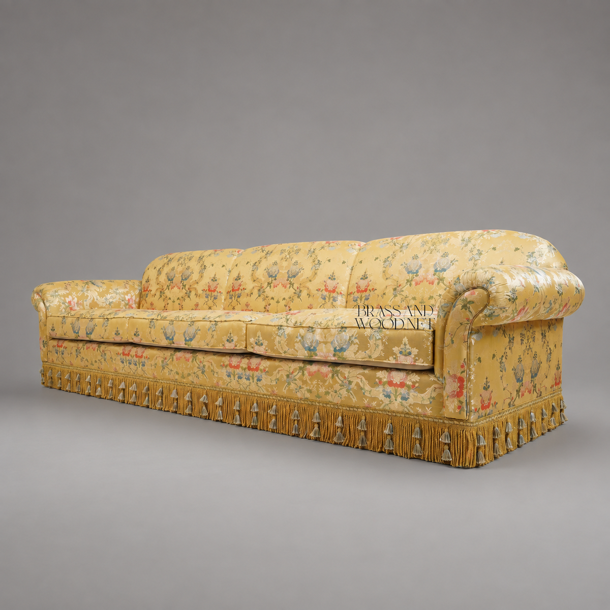 Belle Époque Floral Jacquard Grand Salon Sofa with Tassel Fringe Skirt Three-Quarter View | Brass & Wood