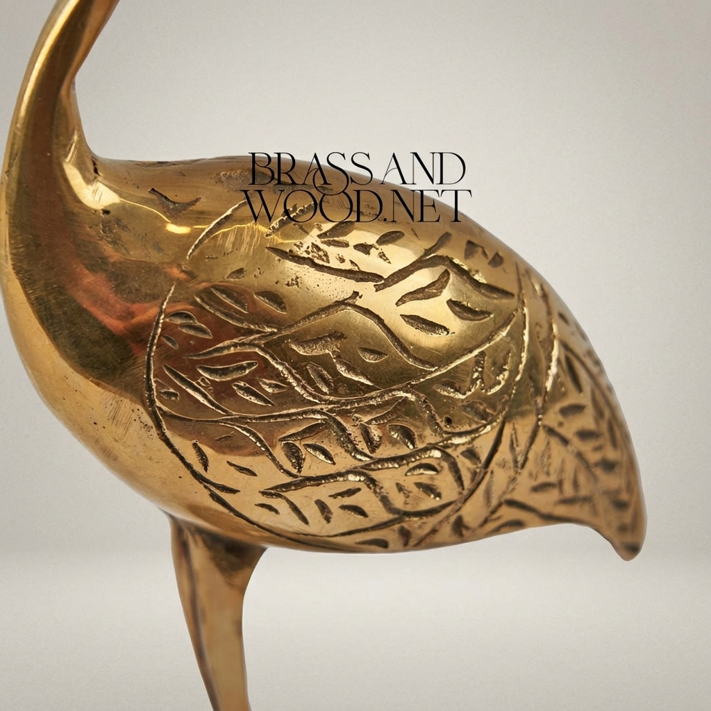 Handcrafted Brass Crane Sculpture with Engraved Foliage Body — Gold