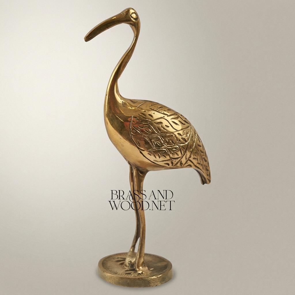 Handcrafted Brass Crane Sculpture with Engraved Foliage Body