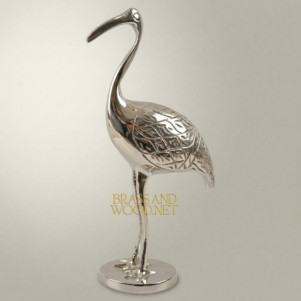 Handcrafted Brass Crane Sculpture with Engraved Foliage Body — Silver