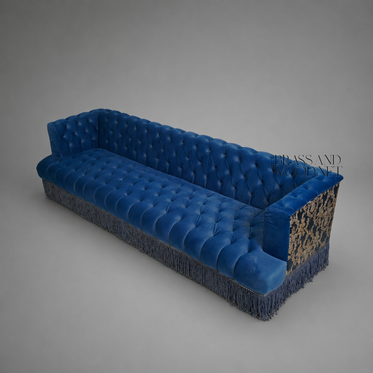Napoleon III Capitonné Navy Blue Velvet Sofa with Damask Panels and Twisted Bullion Fringe Skirt Elevated View | Brass & Wood