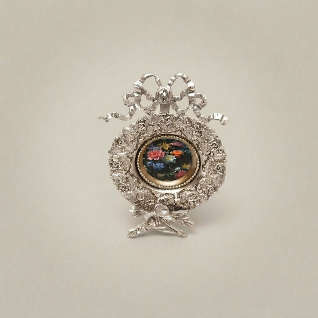 Rococo Brass Oval Frame Display Plate with Bow Crest & Hand-Painted Floral Medallion — Silver