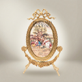 Rococo Brass Oval Stand Frame with Bow Crest & Hand-Painted Pastoral Scene — Gold